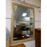 A gilt painted rectangular bevelled glass wall mirror