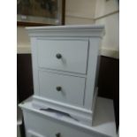 A white two drawer bedside chest (7.14/12) CONDITION REPORT: H. 60 cm W. 48 cm D.