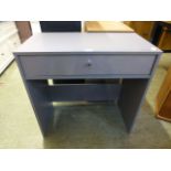 A grey laminated single drawer desk