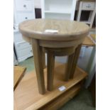 Two circular oak occasional tables (20.