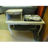 A grey painted telephone seat