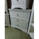 A white three drawer chest (3.