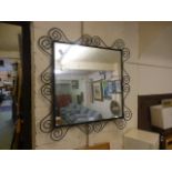 An Ikea metal framed mirror