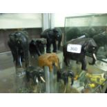 A selection of ebony and other wooden elephants