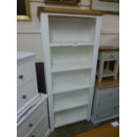 An oak topped and ivory open bookcase (39.