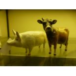 A Beswick pig together with a Jersey cow A/F