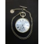 A silver cased swiss made pocket watch with chain