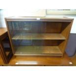 A mid-20th century teak bookcase with sliding glass doors