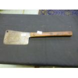 A wooden handled butchers chopper