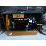 A cased singer manual sewing machine