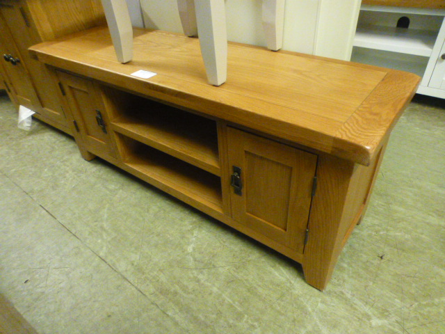 An oak media cabinet (30.