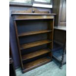 An early 20th century oak open bookcase