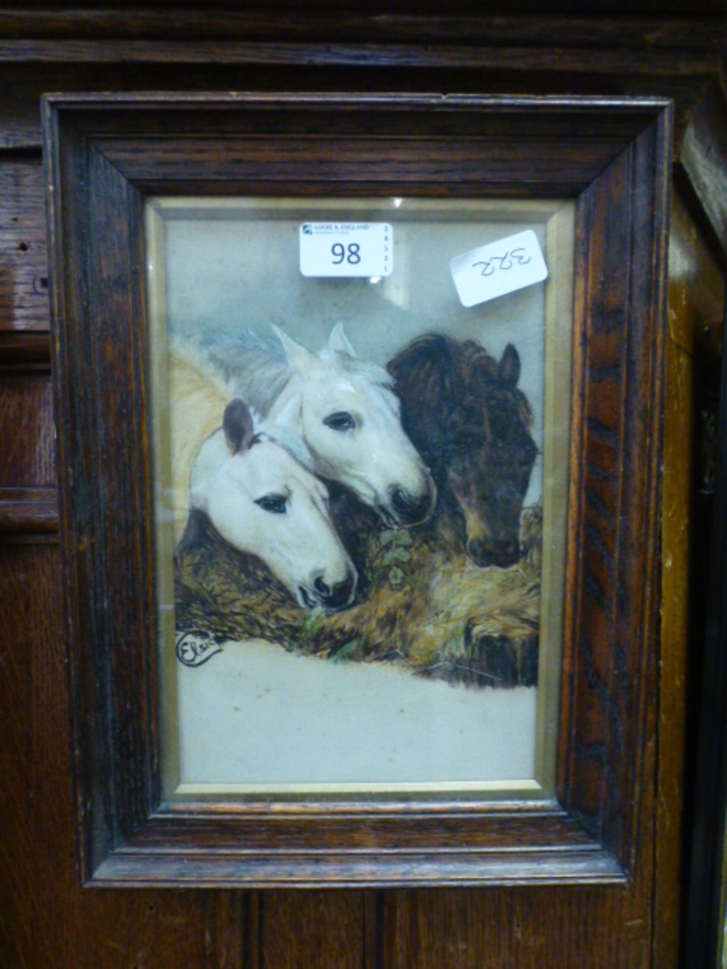 A early 20th century oak framed and glazed print of horses eating