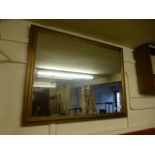 A large gilt painted rectangular wall mirror