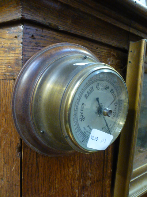 A reproduction ships barometer on wooden mount