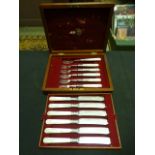 A mahogany cased set of plated fish knives