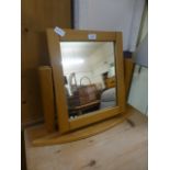 A modern oak swing mirror