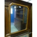 A late 19th century ash and mahogany stop chamfered framed mirror