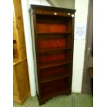 A reproduction mahogany effect full height bookcase