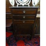 An early 20th century walnut music cabinet,