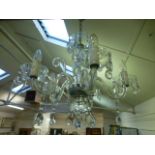 An early 20th century cut glass five branch chandelier