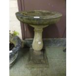 A weathered stoneware bird bath on pedestal CONDITION REPORT: Dia. 44 cm H.