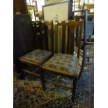 A pair of mid 20th century high back oak dinning chairs