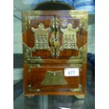 A eastern hardwood brass banded box having a pair of doors above drawers