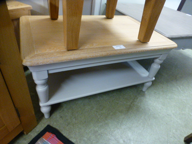 A grey painted coffee table with shelf (54.