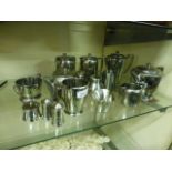 A selection of Old Hall stainless steel tea ware to include water jugs, teapots, cream jugs etc.
