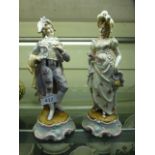 A pair of continental ceramic figurines of lady and gentleman