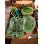 A tray of green leaf design plates