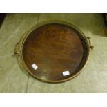 A brass galleried circular tray