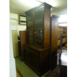 A late Victorian mahogany bookcase cabinet having a pair of glazed doors to top,