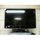 A LG flatscreen TV with remote