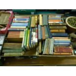 Two trays of hardback books by various authors