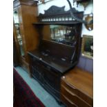 An early 20th century walnut mirror back sideboard