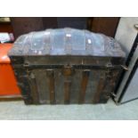 A wooden banded dome top travelling trunk