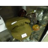 A selection of military items to include goggles, belt,