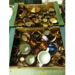 Two trays of lustre glazed pottery to include teapots, cream jugs, water jugs etc.