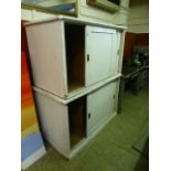 Two white painted sliding door stationary cabinets CONDITION REPORT: Marks and