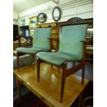 A pair of mid 20th century teak chairs