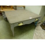 A decorative blue painted coffee table with drawer (68.