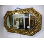 A hammered brass effect bevel glass wall mirror