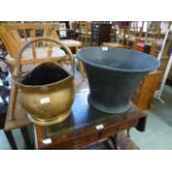 A brass coal scuttle together with a copper planter