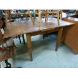 A modern pine drawer leaf table