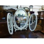 A cream and parcel gilt triple vanity mirror