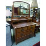 An early 20th century walnut dressing chest having two short over two long drawers to base,
