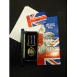 A national service medal with box and paperwork