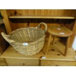 A wicker basket together with a small painted stool